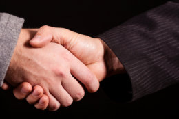 Two businessman handshakes