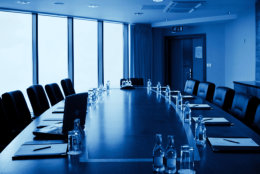 Conference hall Interior with table, raw of chairs and block-notes
